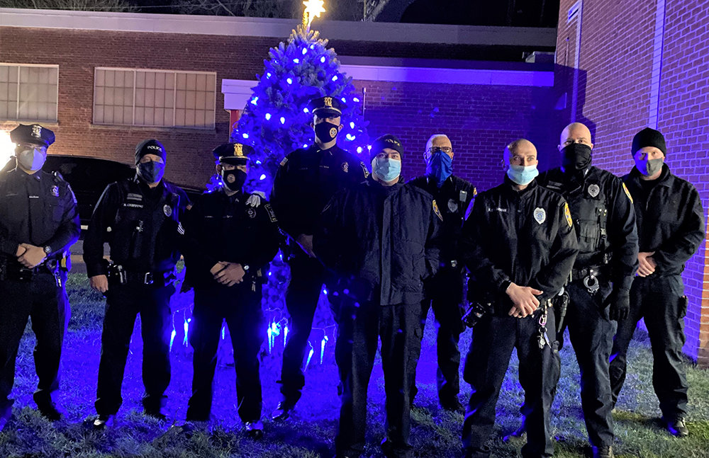 This year’s Blue Light Ceremony was attended by Police Officers [L-R] Nick Paradies LPD; Bruce Griffing MPD; Sgt. Anthony Kalimaras LPD; Lt. Phil Roloson LPD; Chief Gerald  Cocozza Jr MPD; Curt Fulton MPD; Hal DesJardines MPD; Everett Erichsen MPD and Vincent Sayles MPD.